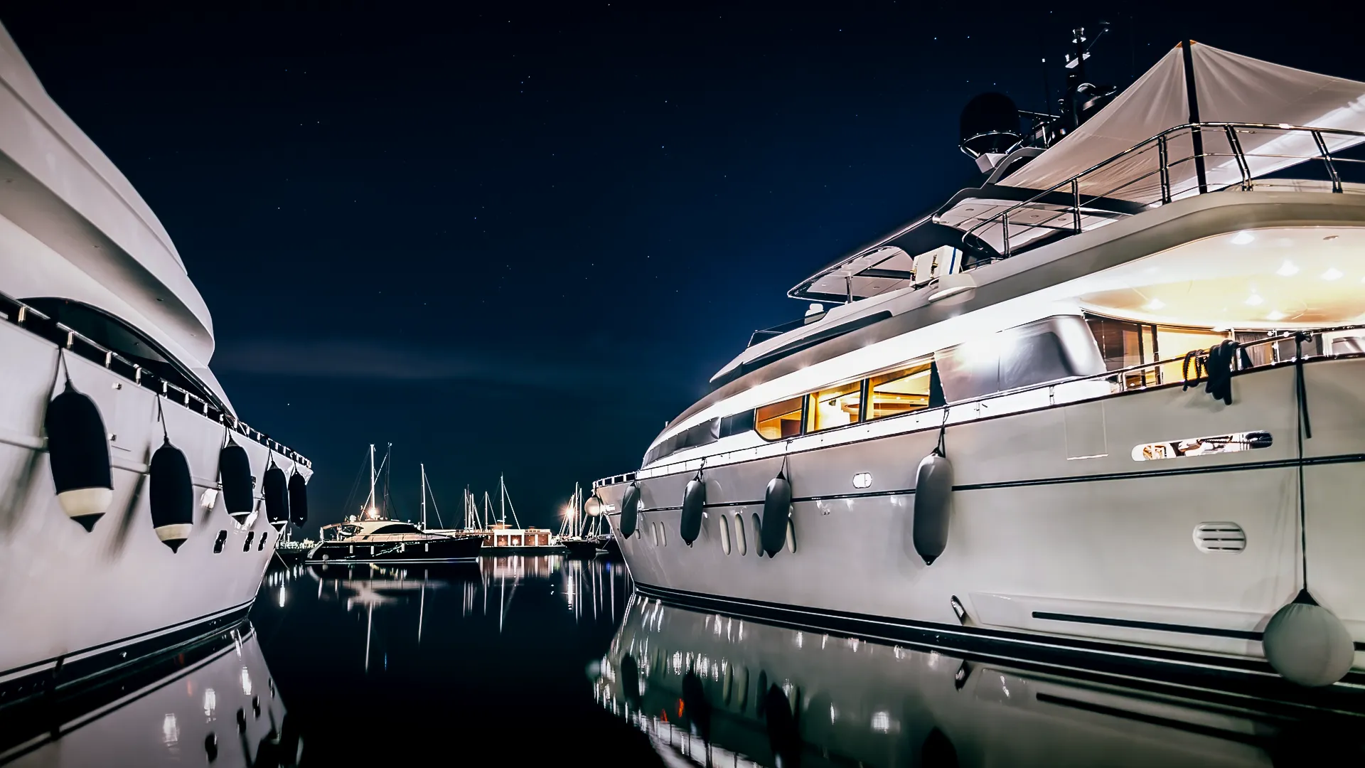 Superyachts moored at night